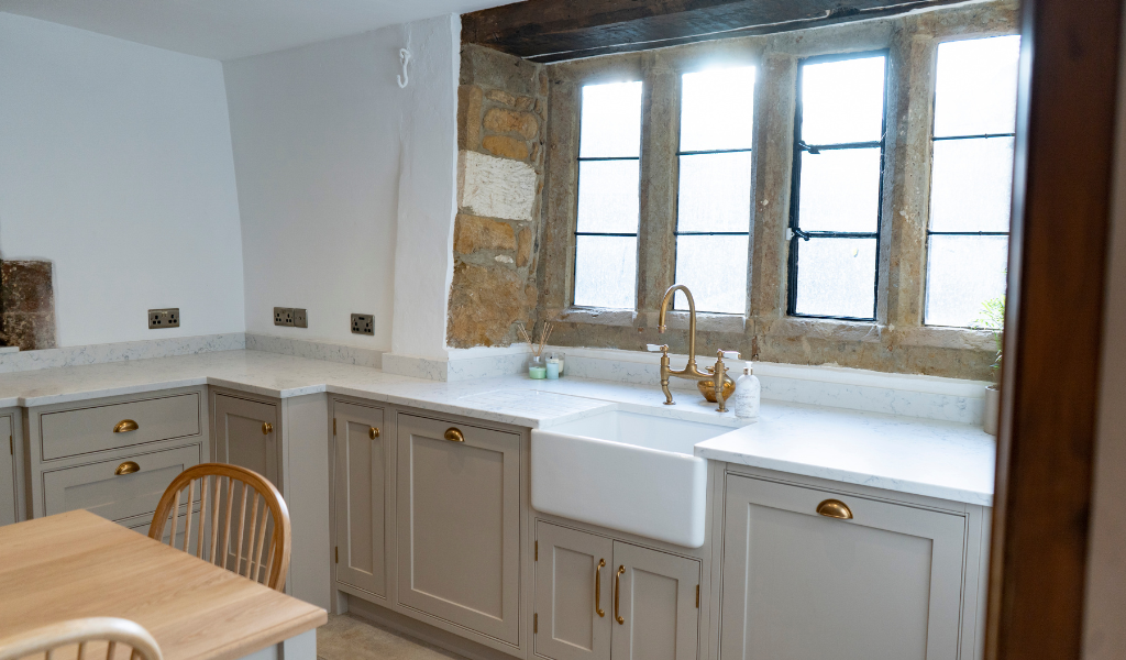 cream kitchen sink cabinet and countertop
